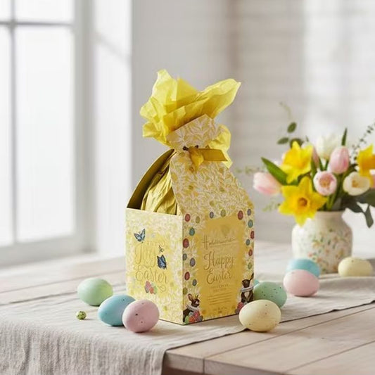 Yellow floral easter egg on table